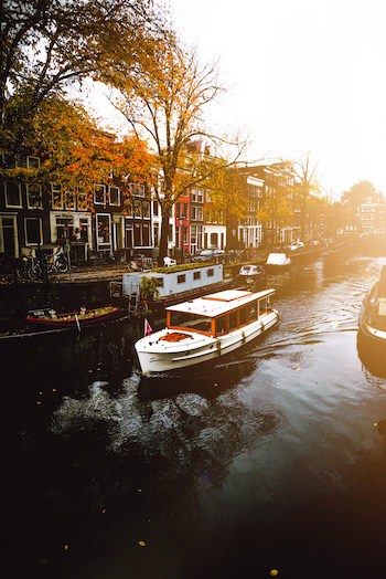 Private canal boat in autumn in Amsterdam